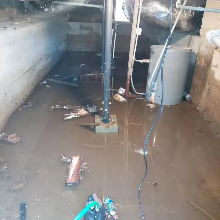 Water heater standing in a flooded basement in Manchester